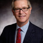 Dr. John Raymond Headshot